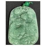 Carved jadeite pendant