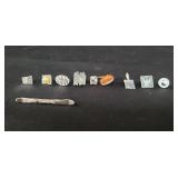 Ten sterling silver pins