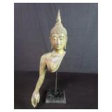brass head and partial torso of a Buddha