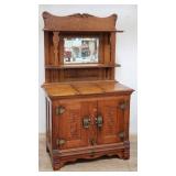 Antique carved oak ice box with mirrored hutch top