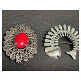 Pair of sterling silver pins