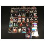 39 sports trading cards in hard cases