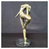 Signed and numbered nude bronze sculpture on a