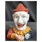 Vintage cast iron clown coin bank