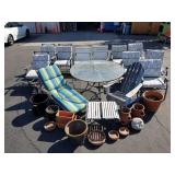 Collection of patio furniture and flower pots