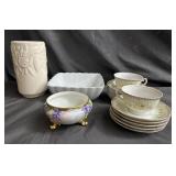 Box of porcelain saucers, teacups, etc