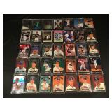 35 baseball trading cards in hard cases
