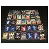 35 baseball trading cards in hard cases
