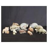 Group of composite armadillo figurines and coin