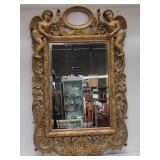 Italian-style ornate gilded beveled mirror