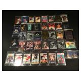 Collection of sports trading cards in hard cases