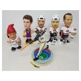 Group of sports bobble heads and figurines