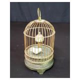 Vintage mechanical bird in cage clock