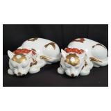 Pair of Japanese porcelain sleeping cat figurines