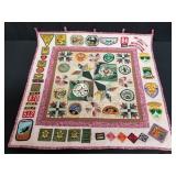 Hand needle quilt with scout patches