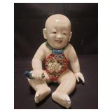 Japanese Satsuma porcelain baby sculpture