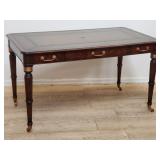 Mitchell Litt mahogany leather top desk on casters