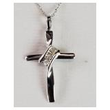 Metal cross pendant with diamonds on a sterling