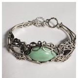 Sterling silver bracelet with a green stone