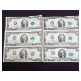 Group of six two-dollar bills