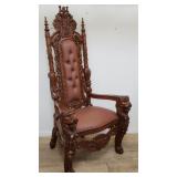 Mahogany and faux leather highly carved throne