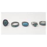 Five silver and turquoise rings