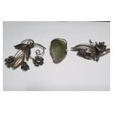 Sterling silver brooches, two signed