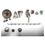 Group of sterling silver earrings and brooches