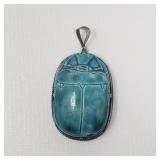 Blue Egyptian style scarab pendant set in silver