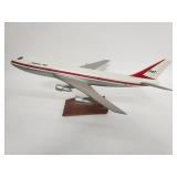 Boeing 747 plastic model jet on a wood and metal