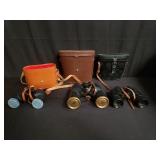 Three vintage binoculars