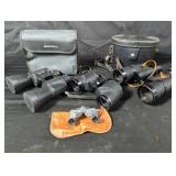 Four vintage binoculars