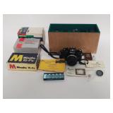 Nikon and Pentax cameras with camera