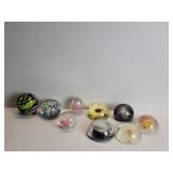 Collection of glass and acrylic paperweights