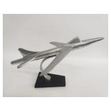 Polished aluminum jet sculpture on wood base