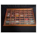 Selection of toy cars in a display case