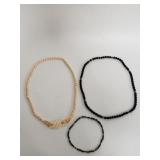 Group of necklaces,  green jadeite, white