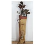 Group of vintage golf clubs and golf balls in