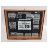 Group of metal aircraft trading cards in a wood