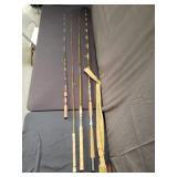 Collection of vintage fishing rods including