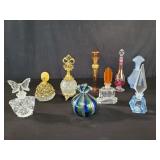 Nine vintage glass and metal perfume bottles