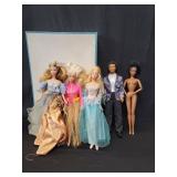Five Barbie dolls