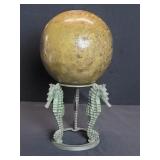 Vintage brass orb on a brass seahorse stand