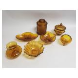 Collection of amber glass bowls, canister and vase