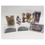 Collection of bobble heads and toy cars