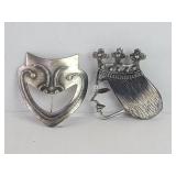 Pair of silver brooches with makers names