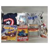 Box of miscellaneous items, t shirts, flatware,