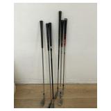 Group of six golf clubs
