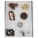Vintage brooches, and earrings signed Rebages.