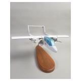 OV-10 Bronco airplane model on wood stand